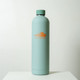 A drink bottle in a soft green colour with a sleek design and a logo on the front.