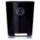 A black glass candle with a circular logo on the front, featuring a metallic base. A black glass candle with a circular logo on the front, featuring a metallic base.