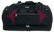 A large black duffle bag with maroon accents and multiple zippered compartments. It features handles and a logo.