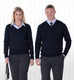 A navy Merino detailed vee pullover for women, displayed on a model alongside a matching men's pullover, both with branding.
