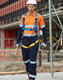 A Hi-Vis men's lightweight cotton coverall in orange and navy, featuring 3M tape and a harness.