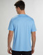 A blue short sleeve tee with a textured fabric and a logo on the back.