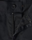 A close-up of black unisex utility stretch cargo work pants, featuring a button and zip closure.