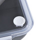 A black lunch box with a clear lid and a white pull-tab for secure sealing. It features a logo on the lid.