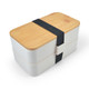 A two-tiered lunch box in white with a bamboo lid, secured by a black elastic band and featuring a branded logo.