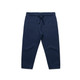Navy track pants featuring an elastic waistband and drawstring, designed for kids with two side pockets.