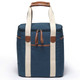A drink cooler with a teal exterior, cream straps, and brown leather accents, featuring a zippered closure and pocket.