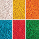 A collection of brightly coloured chewy fruit candies in six sections: white, yellow, orange, red, blue, and green.