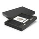 A grey notebook and silver pen gift set presented in a black box with a branded interior.