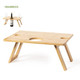 A bamboo table with cut-out holes for drinks, featuring a flat surface and angled legs.
