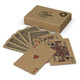 A set of kraft playing cards fanned out beside a kraft box, featuring red and black designs on the cards.