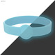 A light blue silicone wristband with a circular imprint area and a glowing effect.