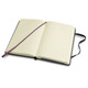 A pocket-sized, classic hard cover notebook in black, featuring lined pages and a ribbon bookmark.