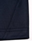 A close-up view of a navy polo shirt sleeve featuring a contrasting seam and stitching detail.