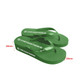 Green rubber thongs with a textured sole and a branded logo. They feature a classic flip-flop design.