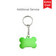 A green bone-shaped pet ID tag on a silver keyring with a logo. A green bone-shaped pet ID tag on a silver keyring with a logo.