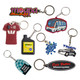 A collection of custom shape PVC keyrings in various colours, including sports jerseys, oil bottles, and vehicles, featuring logos.