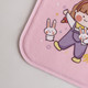 A pink plush cover featuring a cartoon character with bunnies, part of a hot water bottle design.