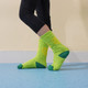 Bright green custom pattern football socks with towel bottom, accented with dark green details.