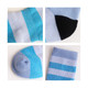 Merino wool socks featuring a light blue design with black and aqua accents, showcasing various sock details.