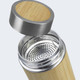 A drink bottle made of bamboo with a stainless steel lid and a mesh filtration insert visible inside. A drink bottle made of bamboo with a stainless steel lid and a mesh filtration insert visible inside.