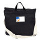 A black canvas shoulder bag with a cream strap, featuring a logo on the front.