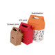 Three die cut handle bags in various colours: orange, red, and brown, showcasing different printing styles.
