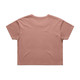 A cropped tee in a muted peach colour, featuring a simple design and a logo. The shirt has short sleeves and a relaxed fit.