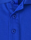 A close-up image of a blue sustainable poly/cotton polo shirt featuring buttons and a collar. A close-up image of a blue sustainable poly/cotton polo shirt featuring buttons and a collar.