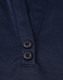 A navy blue polo shirt featuring a two-button placket and a logo. The material is a sustainable poly/cotton blend.