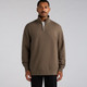 A man wearing a brown half zip crew jumper with long sleeves and a zipper collar. The product has a logo.