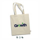 A cream tote bag with long handles featuring a logo in blue and green.