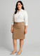 A woman stands wearing a beige mid waist stretch chino skirt and a white shirt, with a logo visible on the skirt.