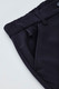 A close-up of navy women's cargo pants featuring a comfort waist and side pockets, with a logo on the fabric.
