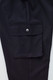 A close-up of black women's cargo pants featuring a side pocket with a button closure and a smooth fabric finish.