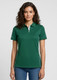 A green women's short sleeve polo shirt with a collar and branding, paired with light blue jeans.