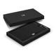 A black notebook and pen gift set displayed in an elegant black box featuring a logo.