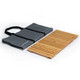 A foldable wooden table in natural colour, accompanied by a grey carrying bag with handles.