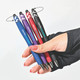 A hand holding four spinner fidget pens in blue, red, purple, and black, each with a stylus tip and unique designs.