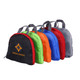 A set of five compressed bags in black, green, orange, blue, and grey, featuring a logo on one.