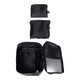 Three black packing cubes of varying sizes, with one open to reveal internal compartments, displaying a zippered design.