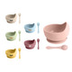 A set of silicone kids' suction bowls in various colours, each paired with a matching spoon, features a logo.