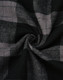 A close-up of black and grey flannel fabric featuring a plaid pattern, showcasing the texture and design.