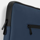 A navy blue soft-touch laptop sleeve with a black zipper detail and a logo on the front.