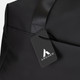 A black soft-touch duffle bag featuring a logo and a stylish tag. The bag has a sleek, minimalistic design.