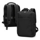 A black soft-touch daily backpack featuring adjustable straps and a sleek design, with a logo on it.