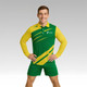 A model wears a green and yellow long-sleeved polo shirt with a logo on the chest, paired with matching shorts.