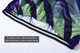 A men's cycling vest in purple and green with an elastic hem and silicone details for a secure fit.