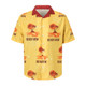 A yellow Cuban collar shirt with a red collar, featuring palm trees, shells, and sunset graphics. It has a logo.