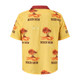 A yellow Cuban collar shirt with a palm tree and sunset print, featuring a maroon collar and logo.